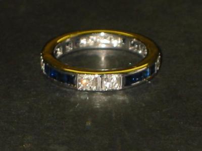 Appraisal: A SAPPHIRE AND DIAMOND ETERNITY RING of full hoop form