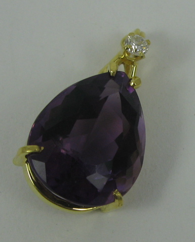 Appraisal: AMETHYST DIAMOND AND FOURTEEN KARAT GOLD PENDANT set with a