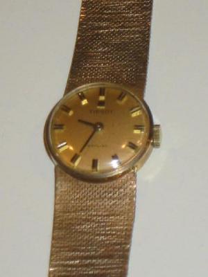 Appraisal: A CT GOLD TISSOT LADY'S WATCH with gold circular dial