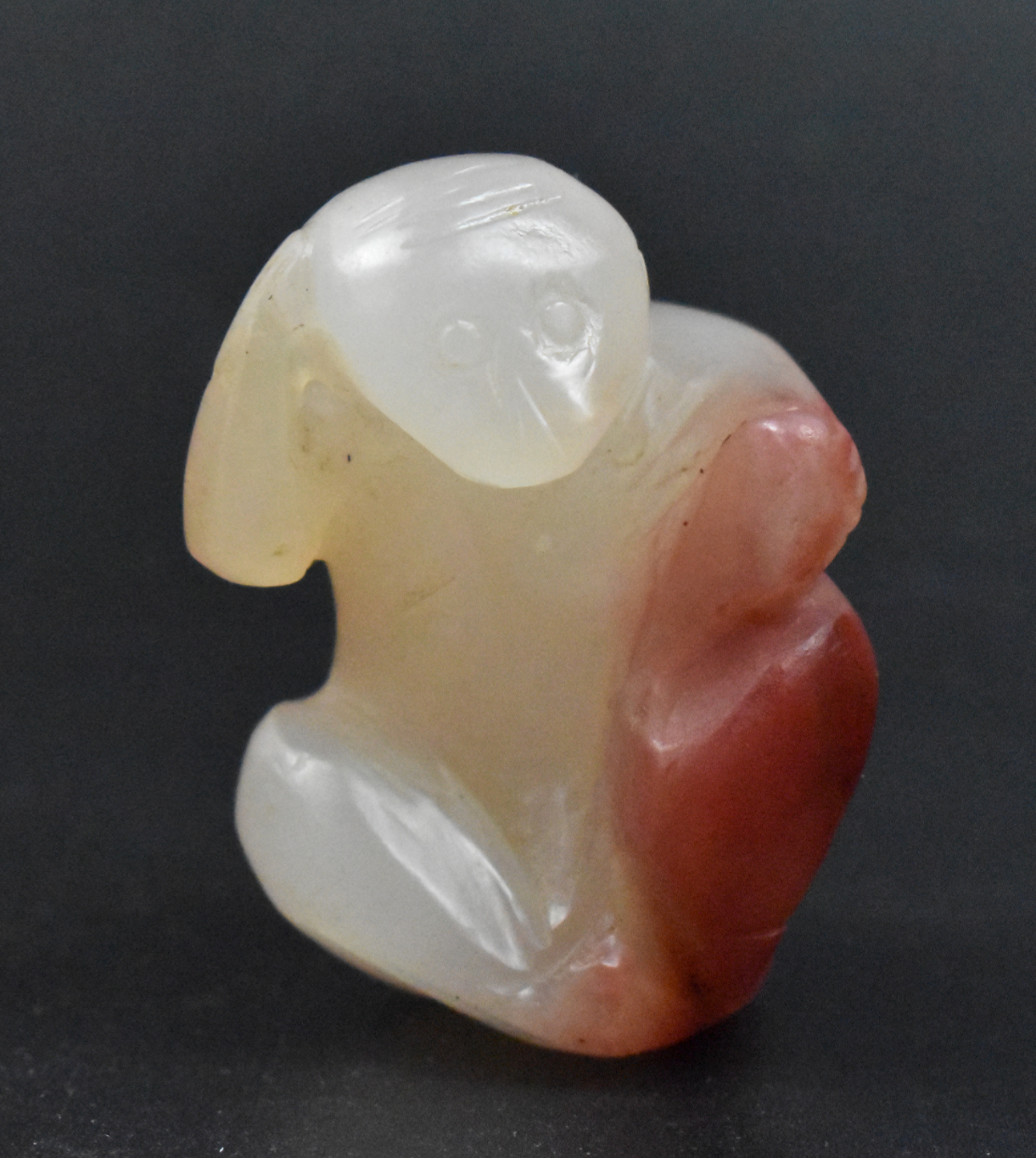 Appraisal: A Chinese agate carved monkey figure dating from the th