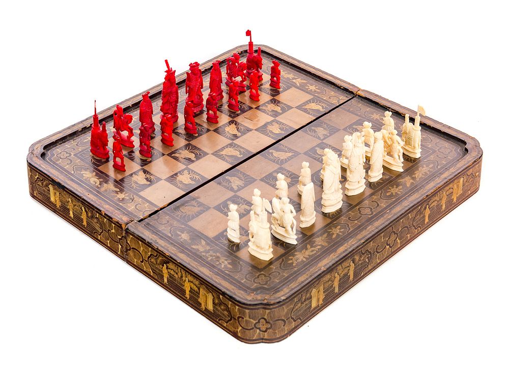 Appraisal: Chinese Lacquered Chess Set with Carved Cinnabar Pieces Chinese lacquer