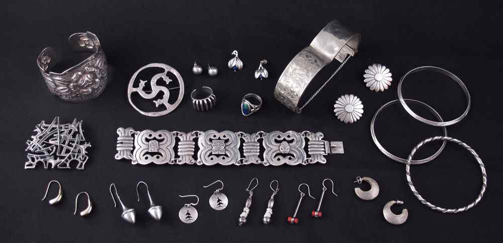 Appraisal: WORLDLY COLLECTION OF STERLING SILVER JEWELRY To include pairs of