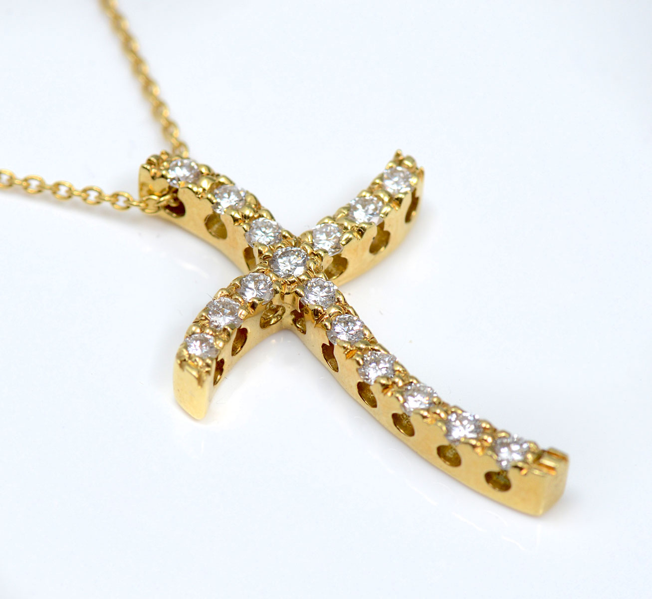 Appraisal: K CROSS WITH DIAMONDS K NECKLACE K modern curved cross