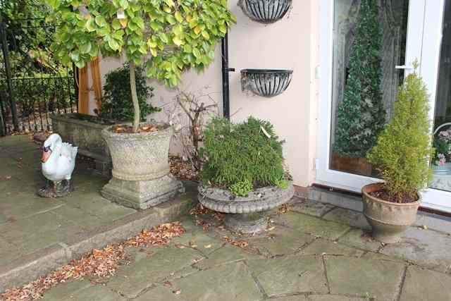 Appraisal: A HADDONSTONE CIRCULAR PLANTER with waisted sides and basket weave