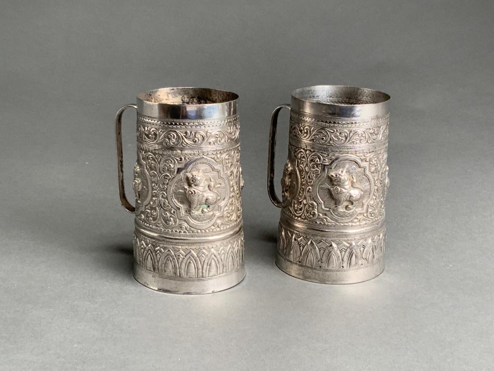 Appraisal: PAIR SOUTHEAST ASIAN LOW GRADE SILVER MUGS OZTPair Southeast Asian