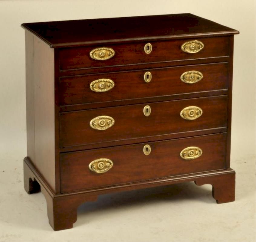 Appraisal: George III Mahogany Bachelor Chest Diminutive George III figured mahogany