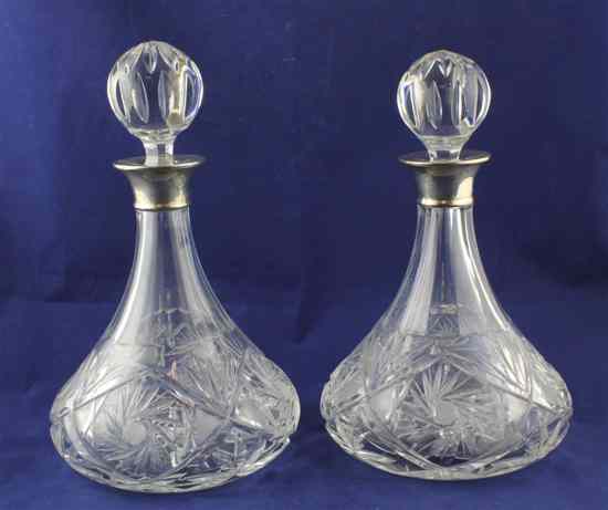 Appraisal: A pair of 's silver mounted cut glass ship's decanters