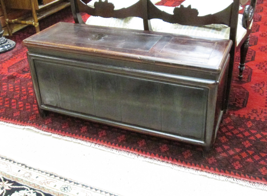 Appraisal: CHINESE COIN CHEST of rectangular bench-like design the top having