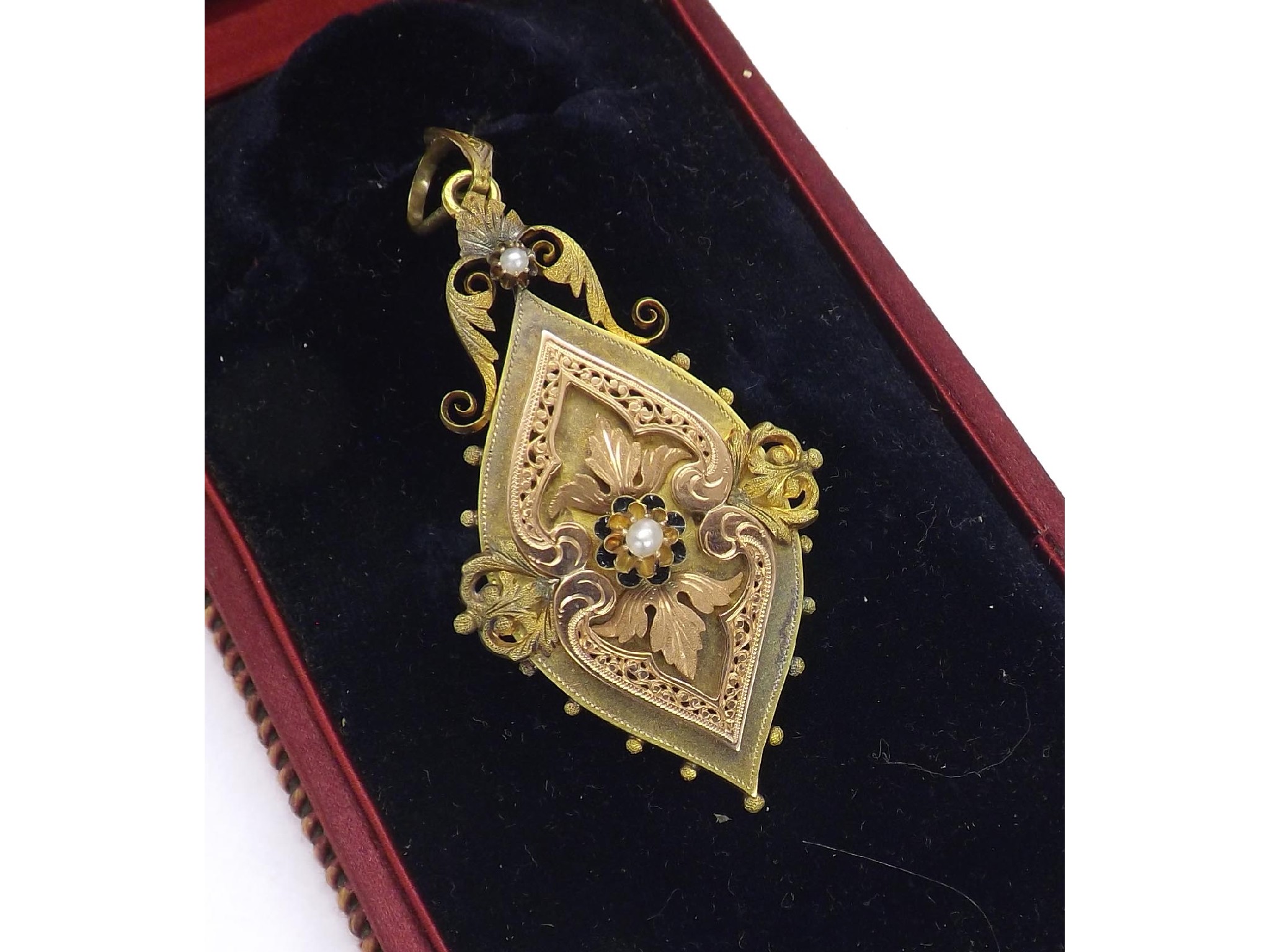 Appraisal: Antique gold mourning locket pendant set with two seed pearls