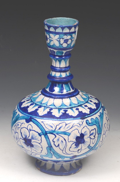 Appraisal: A MIDDLE EASTERN POTTERY BALUSTER VASE with turquoise and blue