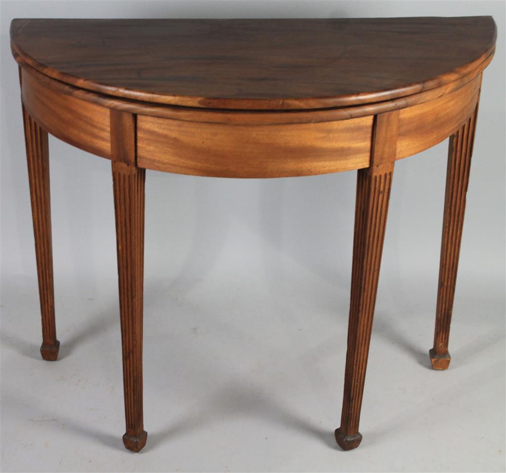 Appraisal: REGENCY CARVED MAHOGANY DEMILUNE CARD TABLE having a hinged demilune