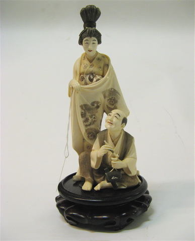 Appraisal: JAPANESE IVORY CARVED OKIMONO woman with th century hair style