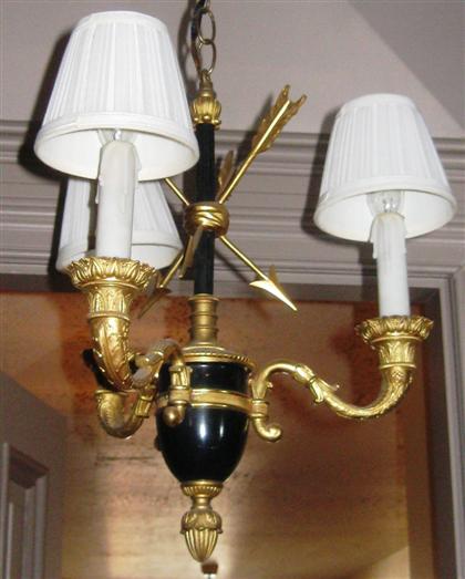 Appraisal: Empire style gilt and patinated metal hanging three light chandelier