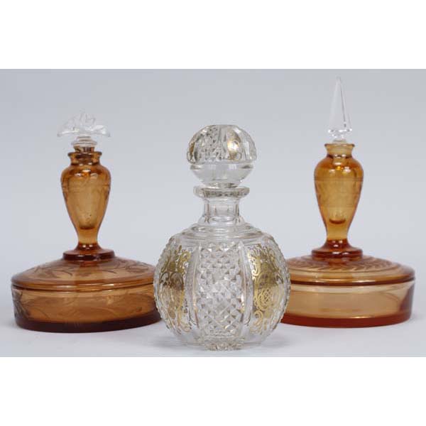 Appraisal: Group of Amber and Clear Dresser Bottles Includes two Amber