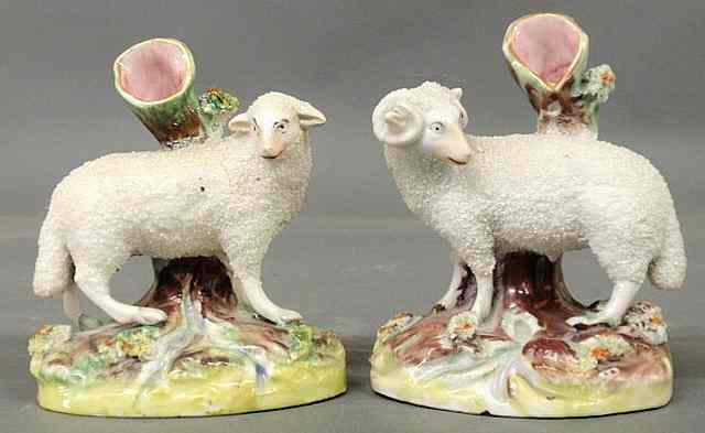 Appraisal: Pair of th c Staffordshire sheep spill vases ewe and