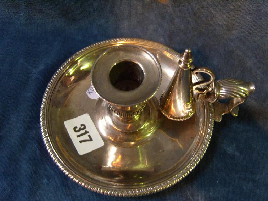 Appraisal: A Georgian silver chamberstick with shaped thumb plate with gadroon