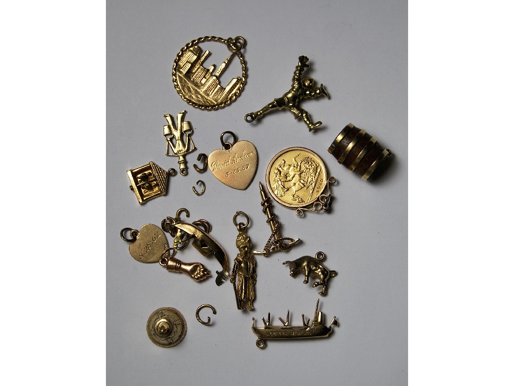 Appraisal: Fourteen various gold charms to w half-sovereign and jump rings