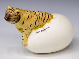 Appraisal: SERGIO BUSTAMANTE CERAMIC EGG EMERGING TIGER Polychrome ceramic egg sculpture