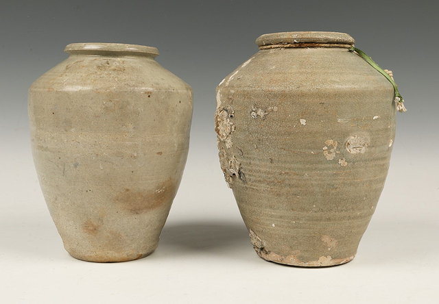 Appraisal: TWO ANTIQUE CHINESE CELADON JARS of tapering baluster form from