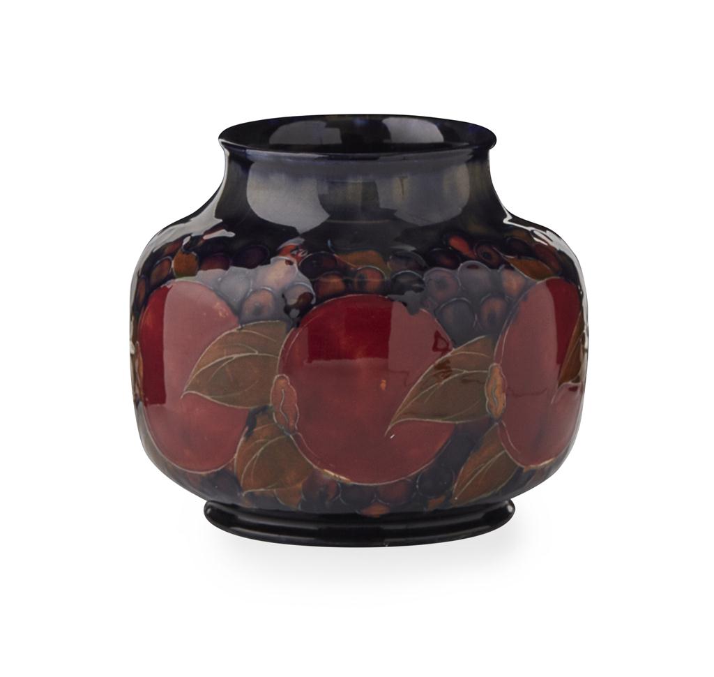 Appraisal: MOORCROFT POTTERY 'POMEGRANATE' PATTERN FLATTENED OVOID VASE S with impressed