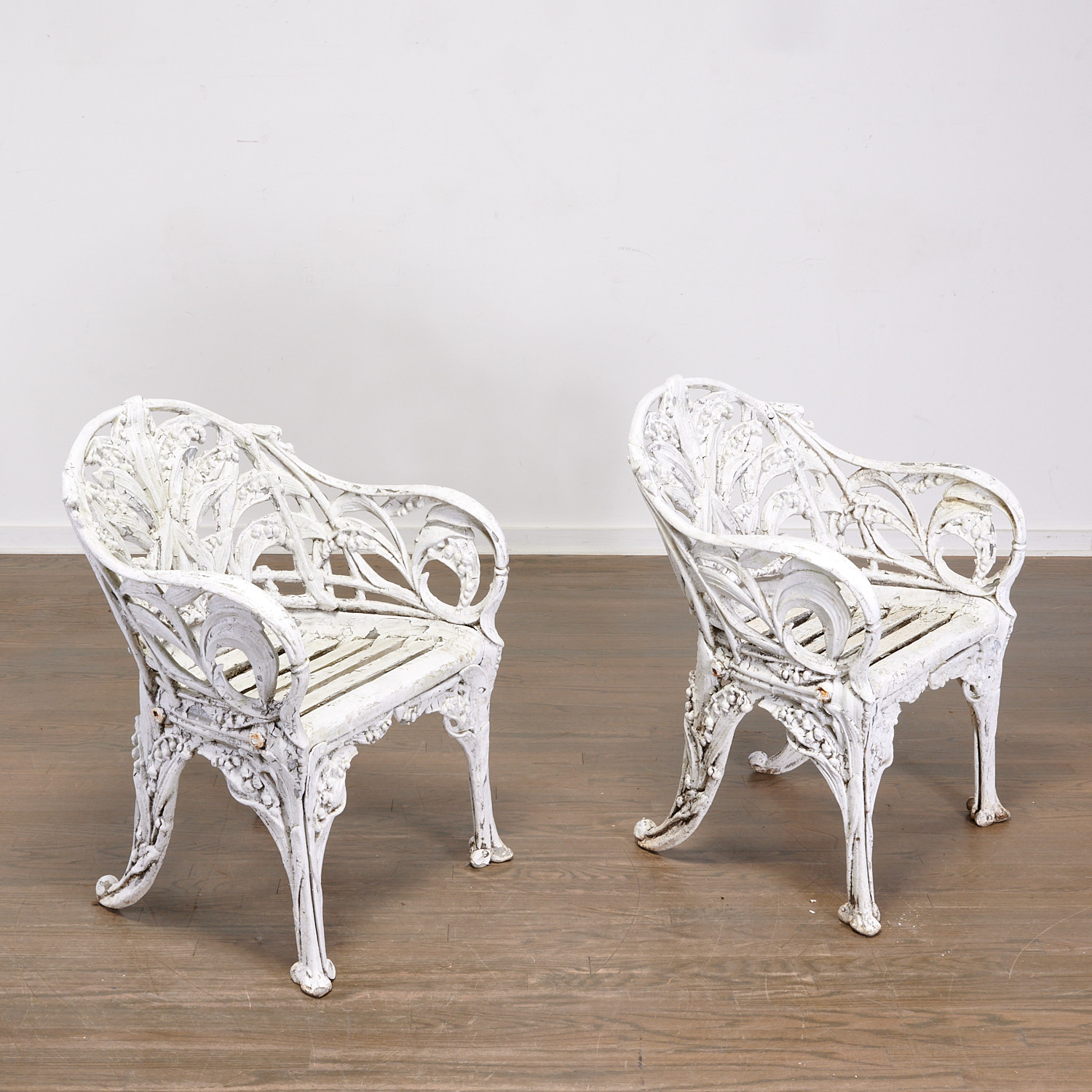 Appraisal: LILY OF THE VALLEY CAST METAL GARDEN CHAIRS First half