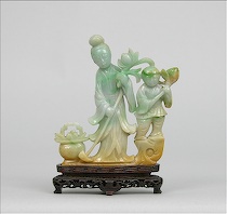 Appraisal: A Nephrite Carved Figural A woman gardening with a baby