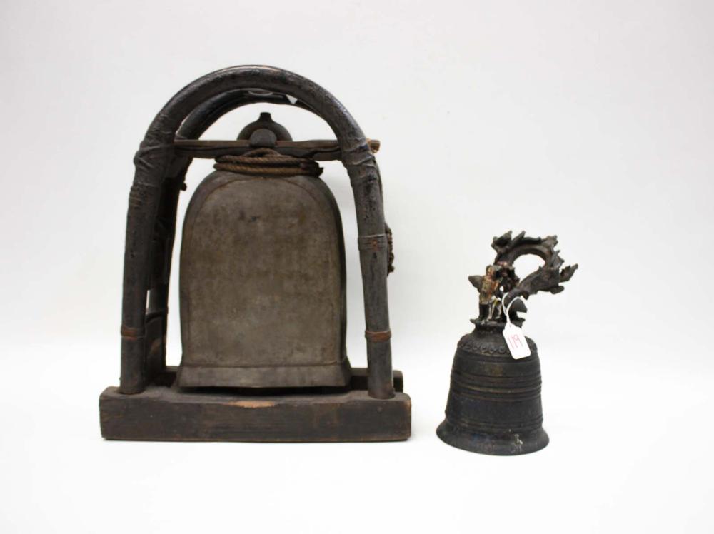 Appraisal: TWO ELEPHANT BELLS large metal bell suspended by leather wood