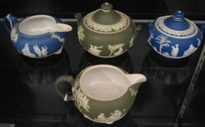 Appraisal: Four piece Wedgwood creamers and covered sugars H tallest in