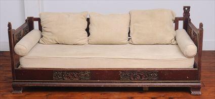 Appraisal: CHINESE RED LACQUER BED The shaped back and sides with