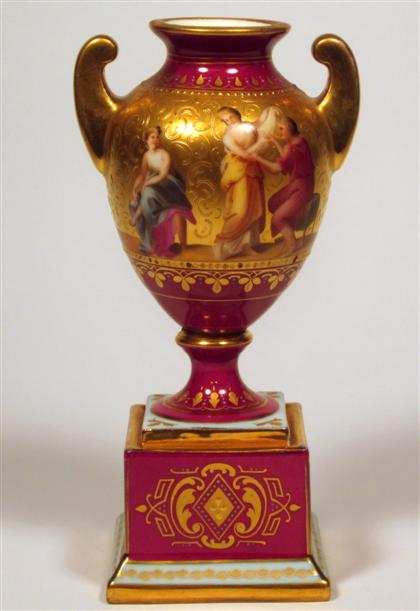 Appraisal: Royal Vienna style ruby ground porcelain urnClassical urn form with