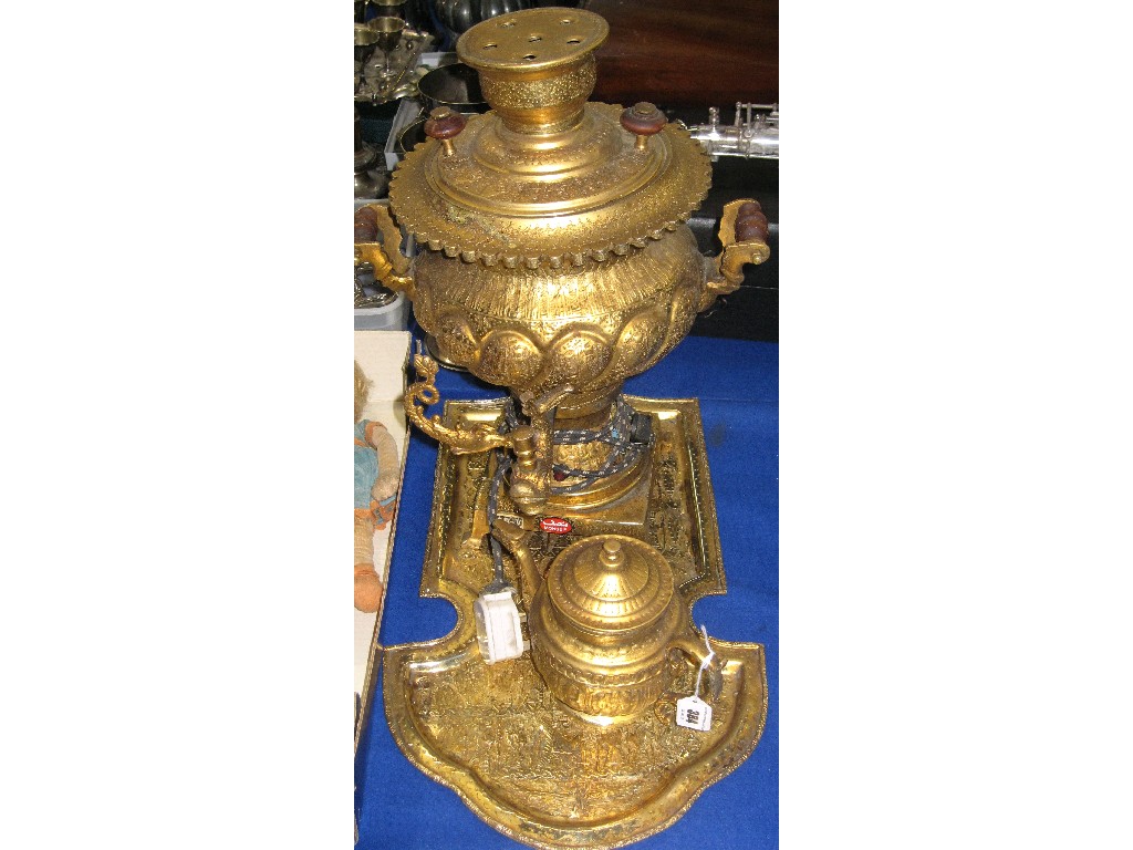 Appraisal: Gilt metal urn and teapot on stand