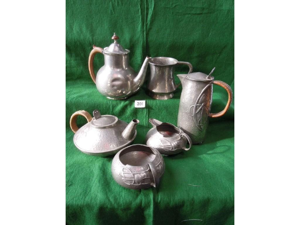 Appraisal: A Liberty Tudric pewter hand beaten four piece tea service