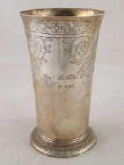 Appraisal: A silver tapering everted beaker on spread foot engraved with