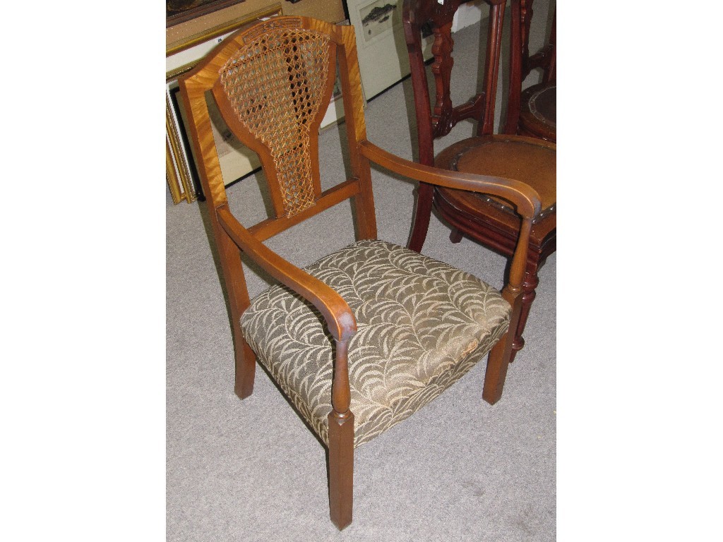 Appraisal: Walnut cane back armchair