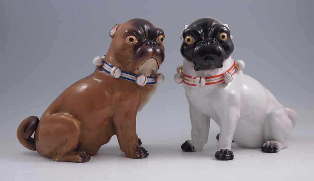 Appraisal: TWO CONTINENTAL PORCELAIN PUG DOG FIGURES In the style of