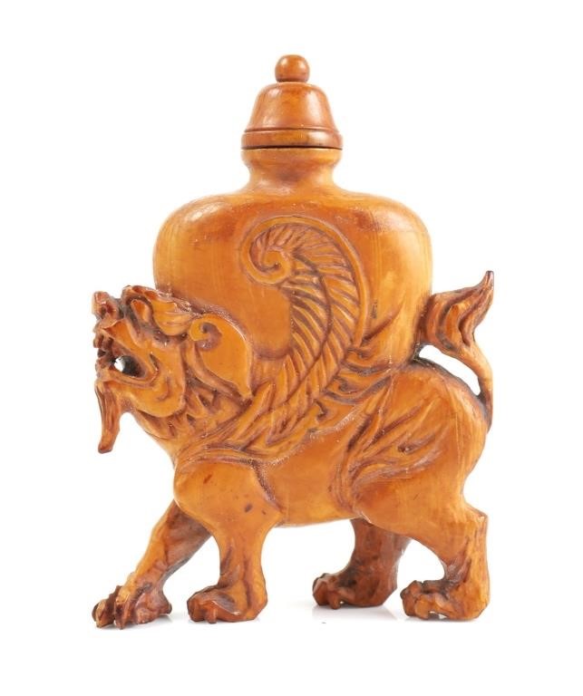 Appraisal: Chinese carved ivory winged lion figural snuff bottle Bottle measures