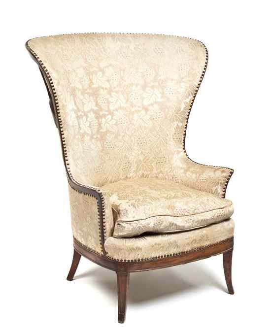 Appraisal: A Wing Back Armchair the upholstered back arms and seat