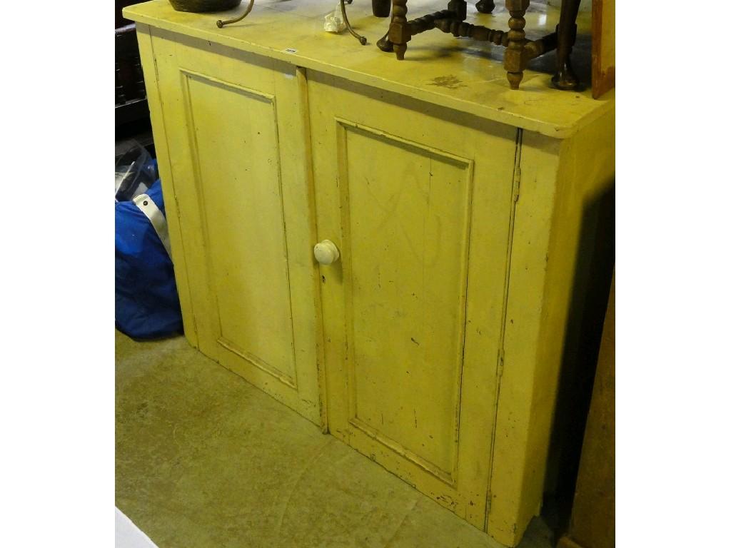 Appraisal: A Victorian painted pine side cupboard enclosed by a pair