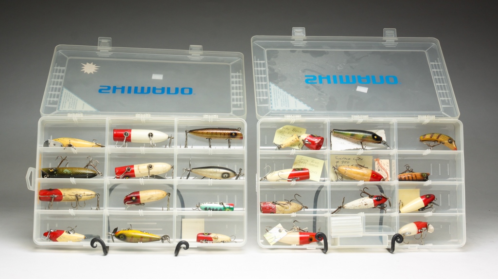 Appraisal: TWENTY-FOUR WOODEN FISHING LURES American th century Including South Bend