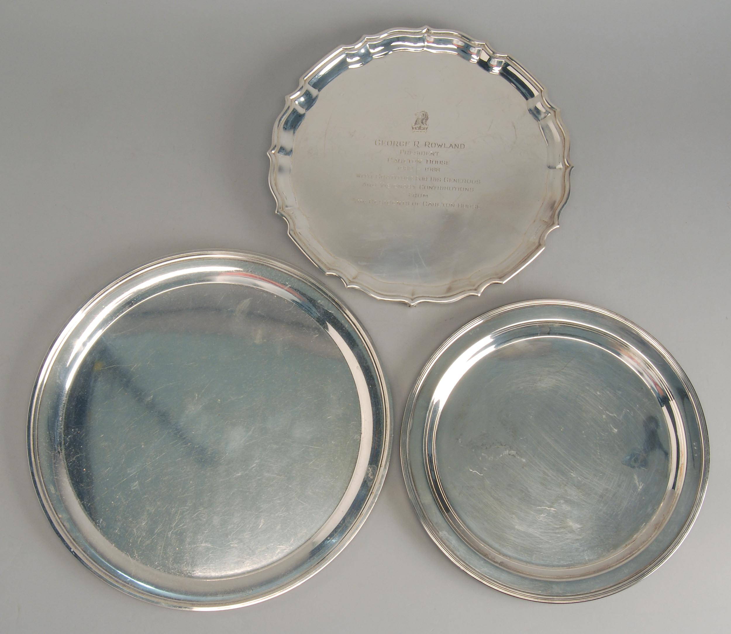 Appraisal: THREE STERLING SILVER TRAYS A circular tray by S Kirk