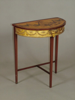 Appraisal: A satinwood and polychrome decorated demi-lune side table circa with