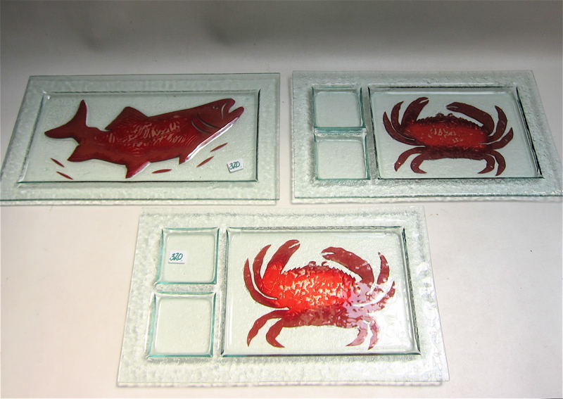 Appraisal: THREE STUDIO ART GLASS SEAFOOD PLATTERS pair having red crab