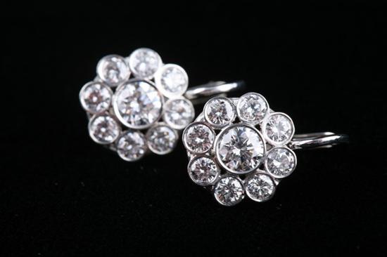 Appraisal: PAIR PLATINUM AND DIAMOND FLORAL MOTIF EARRINGS Each flowerhead set