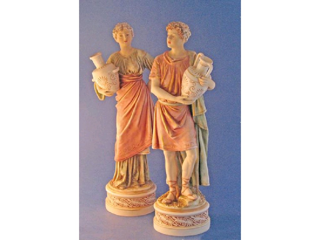 Appraisal: A PAIR OF ROYAL DUX BISQUE FIGURINES of a male