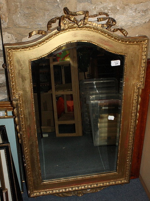 Appraisal: AN TH CENTURY STYLE GILTWOOD HANGING WALL MIRROR with ribbon