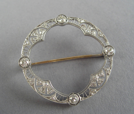 Appraisal: An Edwardian Diamond Platinum and Gold Circle Pin platinum tested