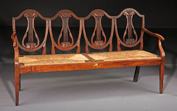 Appraisal: An Italian Neoclassical walnut settee late th century The back