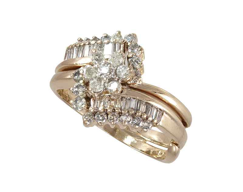 Appraisal: DIAMOND COCKTAIL RING K yellow gold ring contains round brilliant