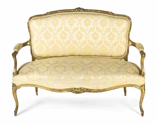 Appraisal: A Louis XVI Style Giltwood Settee having a foliate carved