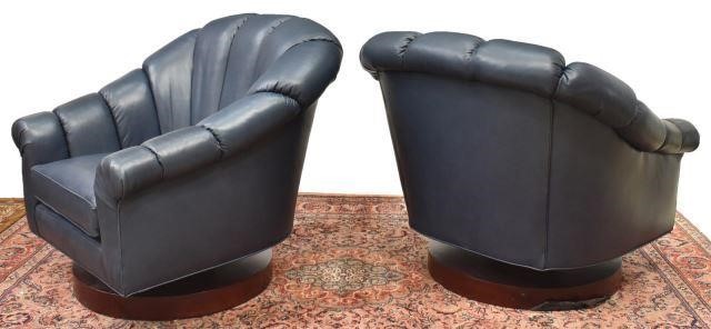 Appraisal: Contemporary lounge chairs late th c in blue leather upholstery